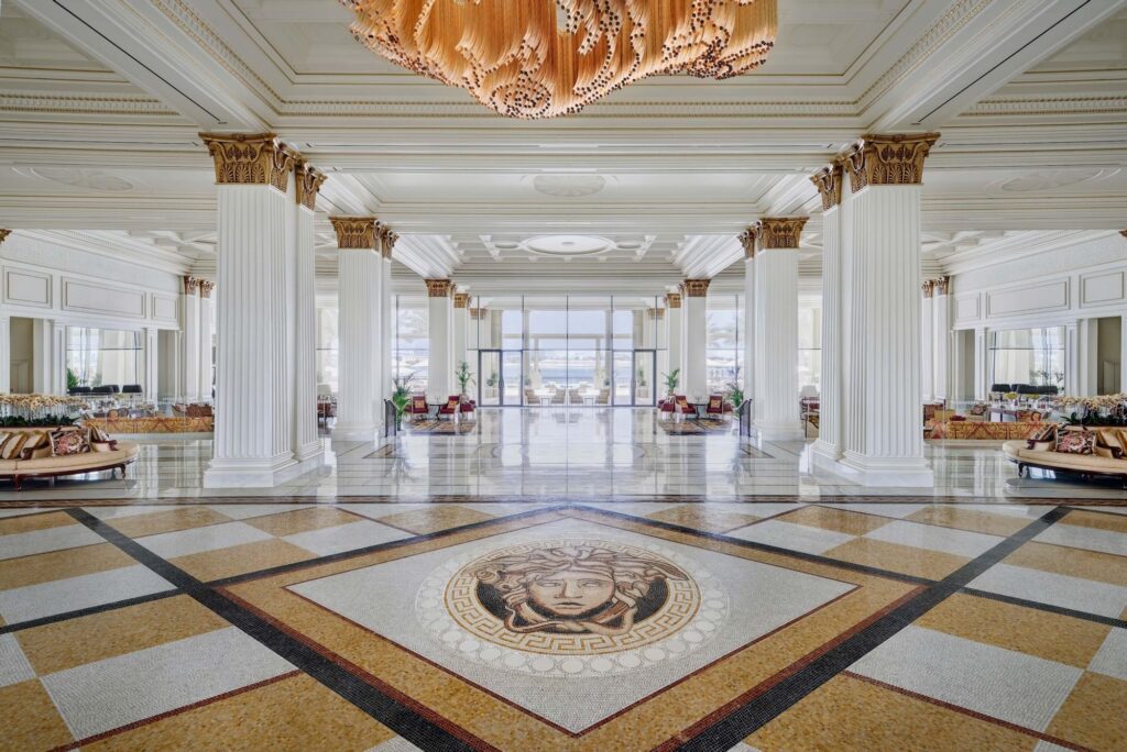 palazzo versace hotel's large hall with columns and a mosaic floor