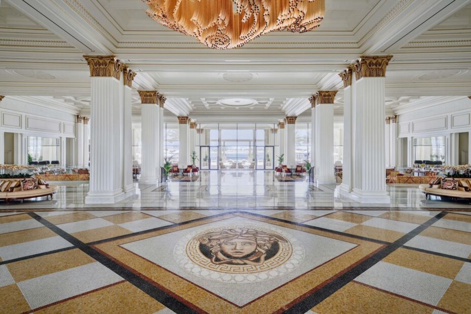 palazzo versace hotel's large hall with columns and a mosaic floor